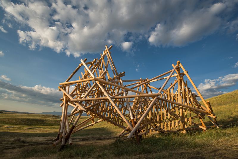 A large wooden installation titled Satellite #5: Pioneer by Stephen Talasnik.